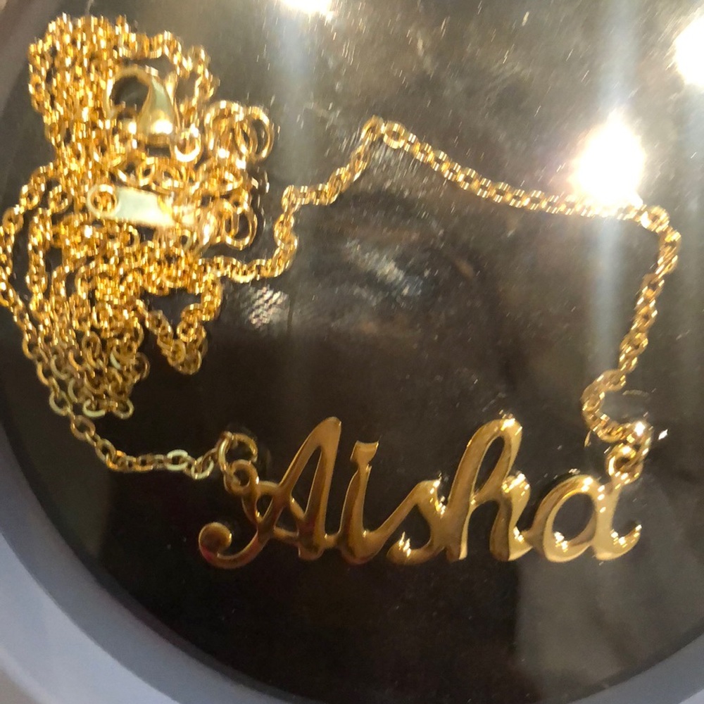 Gold “Aisha” name plate
